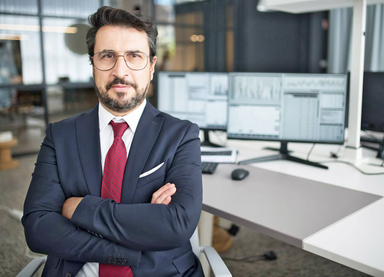 Man Wearing Glasses Sitting at Desk Man Wearing Glasses Sitting at Desk